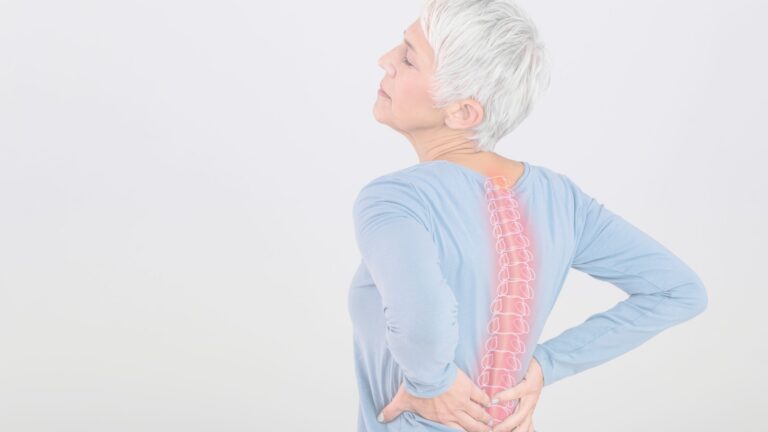 Mature lady suffering from back pain
